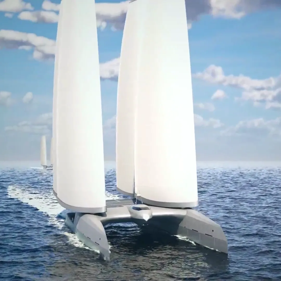 A DRIFT vessel seen from sea level, bow on, wing-sails rising out of frame
