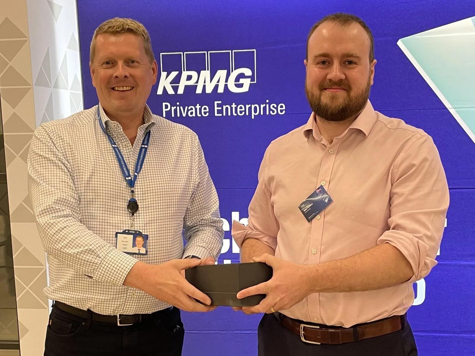 David Williams of KPMG (left) hands the award to Mike Mackay of DRIFT Energy (right)