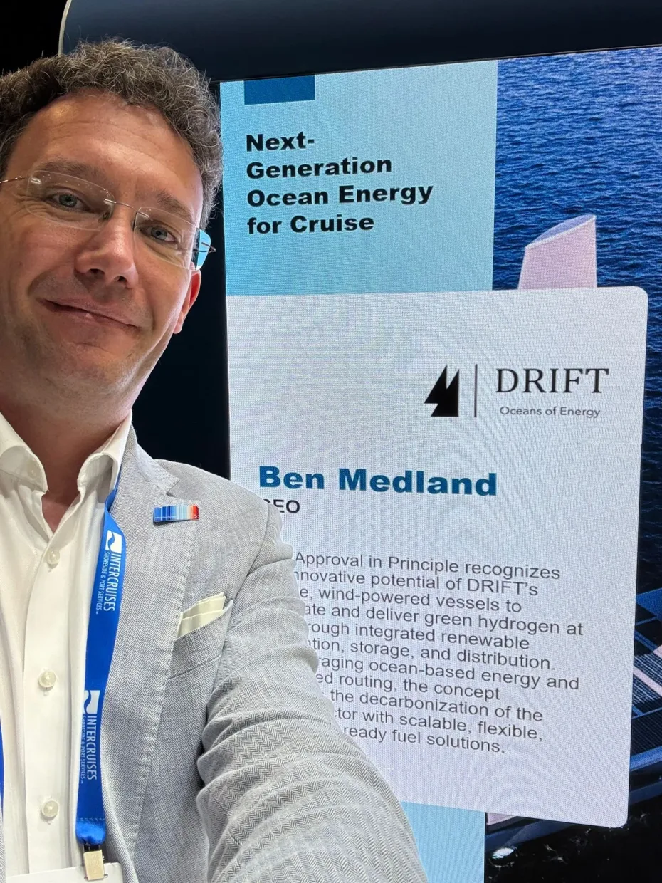 Ben Medland beside a DRIFT presentation screen at Seatrade Cruise Global, headed “Next-Generation Ocean Energy for Cruise”